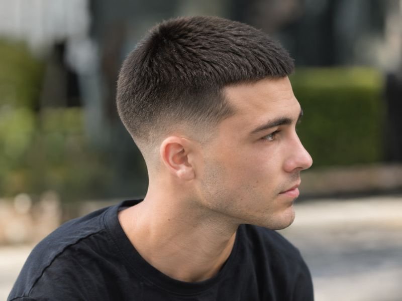 4 guard buzz cut with a low taper, side view