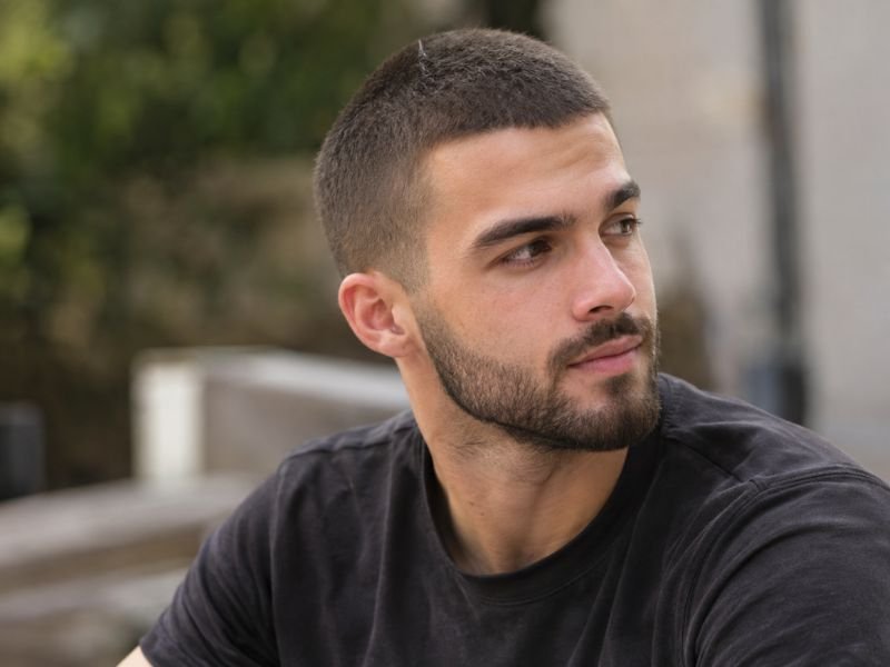 Man with a short beard and a 4 guard buzz cut